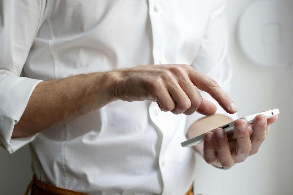 man using a mobile app for a greener business