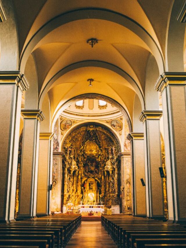the inside of a church showing the pillars and altar showcasing the Importance of Cleaning High-Touch Surfaces in Churches