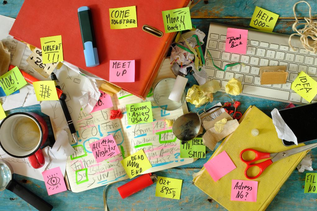 dirty and cluttered office desk