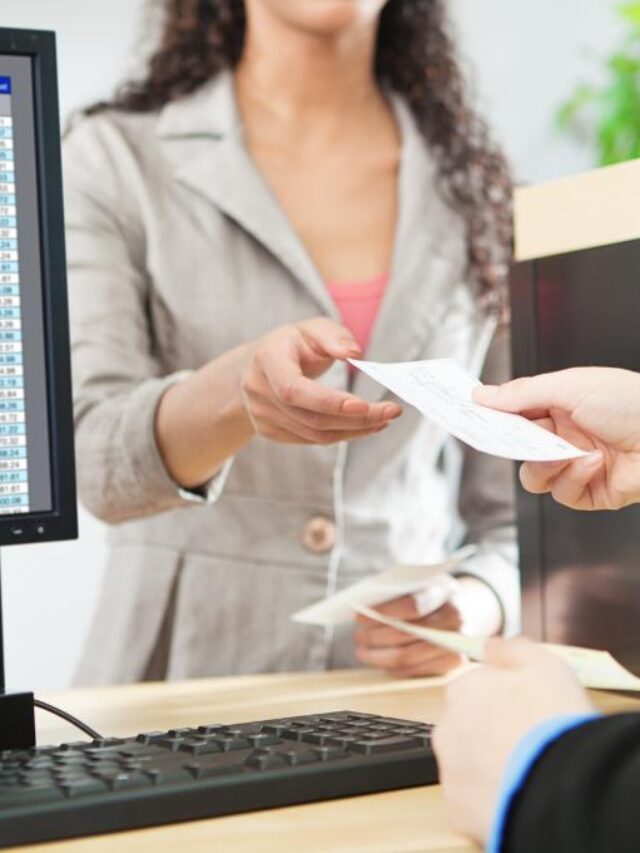 Bank receptionist handing money