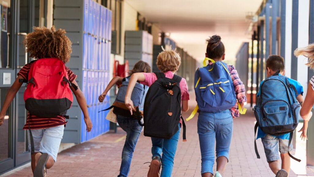 kids running ina school hallway